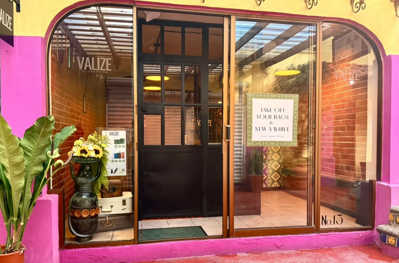 VALIZE’s glass storefront and open doorway inside Plaza Romy, beside the tiled staircase
