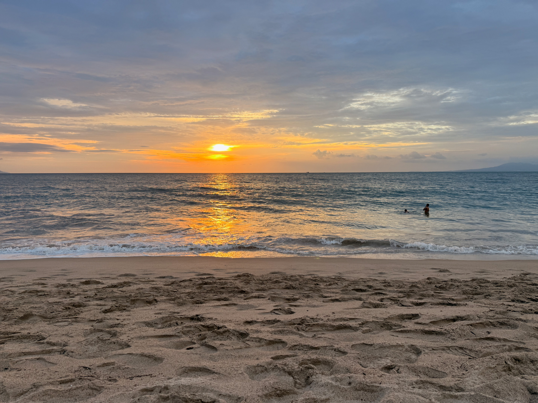 Sunset reflected across the ocean at a Puerto Vallarta beach